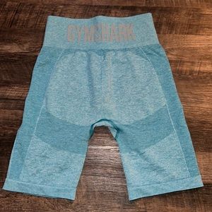 Blue Gymshark athletic shorts.